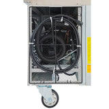 Close-up of a metal cart, resembling a stainless steel refrigerated stand, with a mesh front containing coiled black cables secured by white zip ties. Electronic components are visible inside, and yellow text appears on the right near a large gray caster wheel.