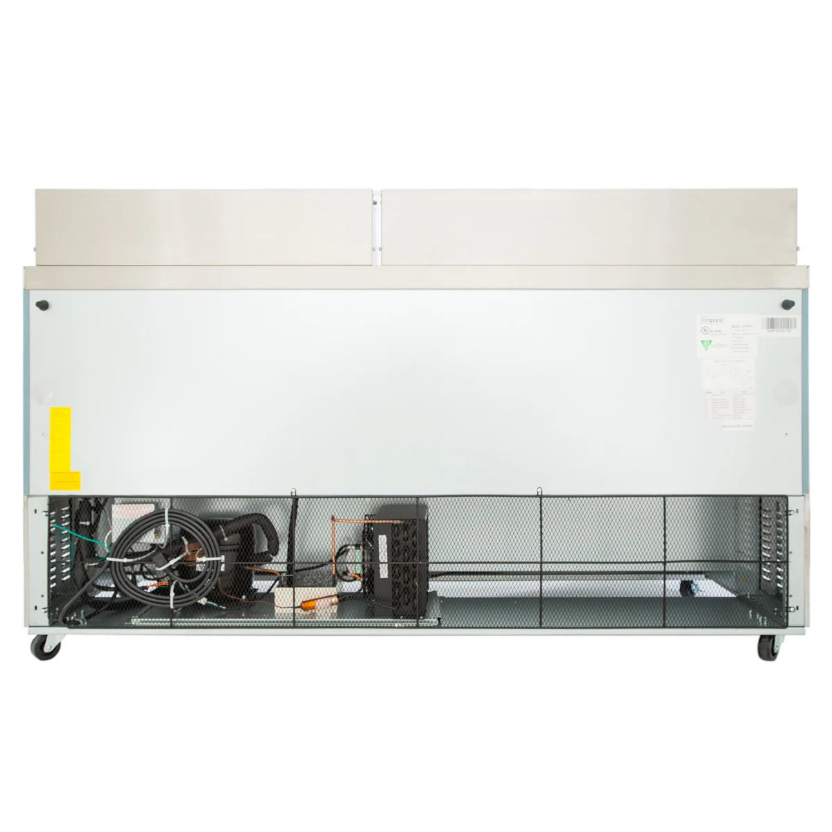 A commercial refrigeration unit viewed from the back; the lower section is open, revealing wiring, metal pipes, and mechanical components behind a mesh panel. The upper section has a solid metal panel with a white finish. The refrigerated sandwich prep table is on wheels.