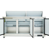 A stainless steel refrigerated sandwich prep table with two open top lids and two open front doors reveals empty interior shelves and compartments. This commercial refrigeration unit is on wheels and features a digital control panel at the bottom right.
