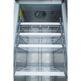 A photo showing the interior of an empty Empura Refrigeration reach-in refrigerator with five metal wire shelves and a fan at the top rear. The shelves are evenly spaced, and the metallic, reflective walls enhance its professional appearance.
