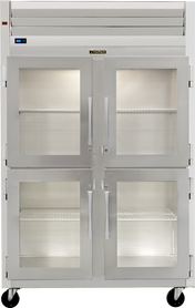 A large Traulsen commercial stainless steel reach-in refrigerator with four glass doors, metal handles, and visible wire shelves inside. The unit includes wheels, top ventilation, and a digital temperature display on the upper left.