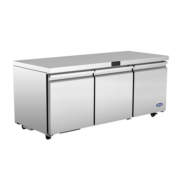 The Atosa AUR72SD is a commercial stainless steel three-door undercounter refrigerator with a flat top, ideal for kitchen prep work. It features caster wheels, a digital display above the center door, and a blue logo on the bottom right door.