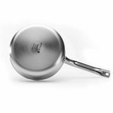 A De Buyer Alchimy Saute Pan is shown from the bottom, displaying engraved branding and details. The 18/10 stainless steel pan features a long metal handle with a hole at the end, set against a plain white background.