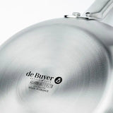 Close-up of the bottom of a 7.8 inch De Buyer Alchimy Saute Pan. The de Buyer logo, product details, induction symbol, and Made in France text are clearly engraved on the brushed stainless steel surface.