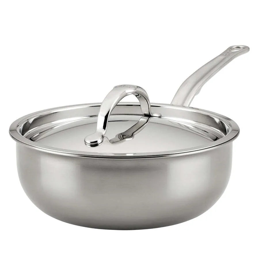 A shiny Hestan Nanobond Saucier pan from JB Prince, 2.0qt, with high sides and a polished stainless steel finish. The long curved handle and matching lid add to its sleek look, reflecting light off their smooth surfaces.