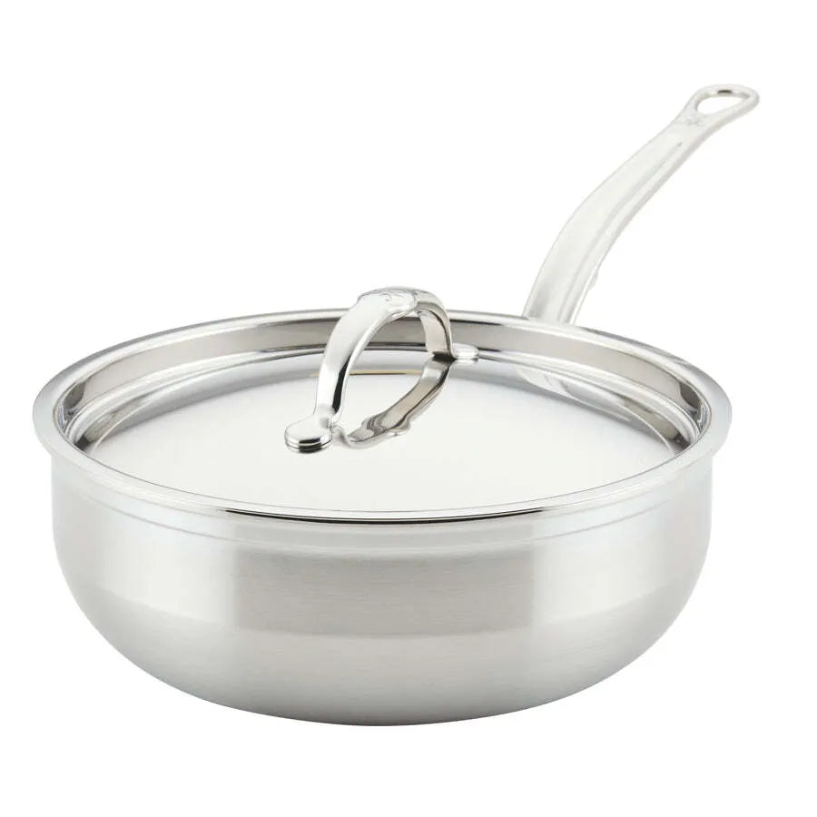 A shiny Hestan Probond Essential Pan, 3.5qt pan, with a long handle and fitted lid featuring a curved top handle. The smooth, reflective stainless steel finish and slightly flared sides stand out against the plain white background.