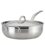 A shiny 28cm stainless steel sauté pan, like the Hestan Probond Essential pan, with a matching domed lid and long curved handle. The wide, flat bottom holds up to 5.0qt, and sturdy metal rivets secure the handle to the body. The lid features a loop handle.