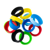 A pile of colorful silicone wristbands, inspired by the vibrant hues of widemouth sauce bands, is arranged on a white background. The black, yellow, blue, green, and red bands overlap in a loose, scattered circle.