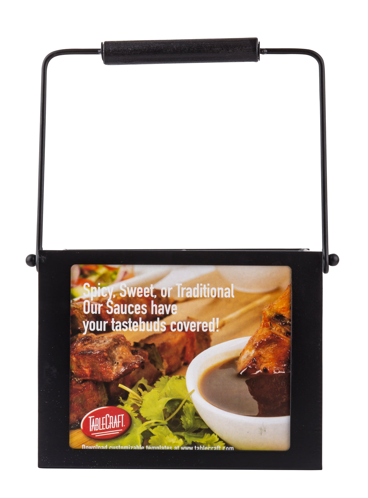 A black metal 4-compartment squeeze bottle caddy with a handle. An attached label displays grilled meat, sauces, greens, and text: “Spicy, Sweet, or Traditional. Our Sauces have your tastebuds covered!” plus the TableCraft Products logo.