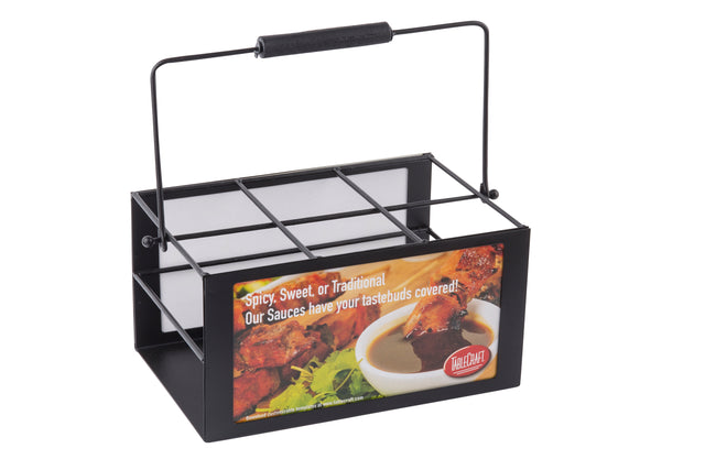 A black metal TableCraft squeeze bottle caddy with a handle and six compartments. The front features chicken wings, dipping sauce, and the text: “Spicy, Sweet, or Traditional—Our Sauces have your tastebuds covered!”.