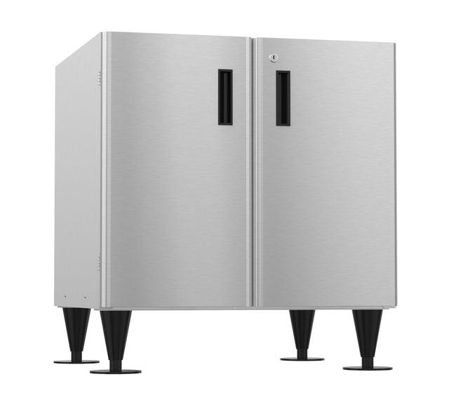 A modern stainless steel cabinet, ideal as an equipment stand, with two vertical doors featuring black rectangular handles. It stands on four tall, black tapered legs with round bases and boasts a minimalistic brushed metal finish.
