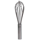 A TableCraft French Whip with a stainless steel cylindrical handle and looped metal wires stands upright against a white background. The handle features a logo engraving, making this clean, reflective whisk ideal for mixing or beating cooking ingredients.