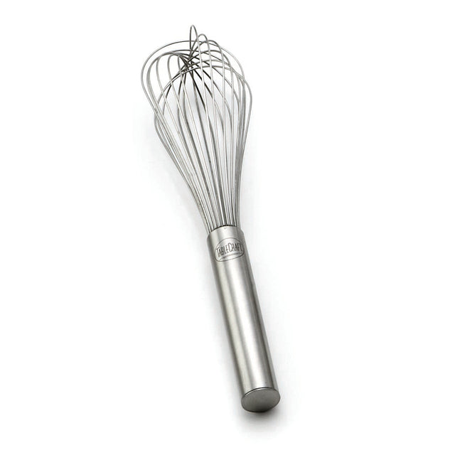 A TableCraft French Whip made of stainless steel, featuring a cylindrical handle and multiple thin, looping wires forming a balloon shape at the top, rests on a white background.