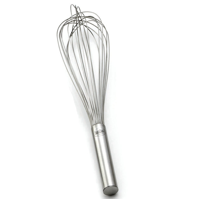 A stainless steel French Whip balloon whisk lies on a white background. It features a cylindrical handle with a small engraved logo and thin, curved wire loops for whipping or mixing. This whisk is also dishwasher safe for easy cleaning.