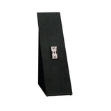 The Dispense-Rite SFL-STAND-1 is a black, upright, rectangular Angled Stand with a metal mounting bracket at its center. Its design features a slightly angled back and flat base to securely support or display items vertically.