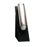 A silver, cylindrical Dispense-Rite countertop dispenser holds disposable plastic cups. Mounted on a black SFL-STAND-1 angled stand, one cup protrudes slightly from the bottom opening. The background is plain white.