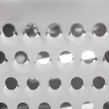 Close-up of a stainless steel surface with three horizontal rows of round holes. The shiny, reflective finish and interplay of light create highlights and shadows, giving this metal a modern, industrial look—perfect for a grater or other dishwasher safe tools.