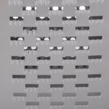 Close-up of a stainless steel grater surface with multiple rectangular holes, each edged with semi-circular notches. The shiny, silver metal reflects light, highlighting the smooth and sharp contours. Dishwasher safe for easy cleaning.