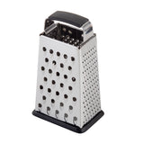 A stainless steel box grater with four sides, each offering different-sized grating holes. It features a black plastic handle and rubber base for stability, is dishwasher safe, and stands upright on a white background.