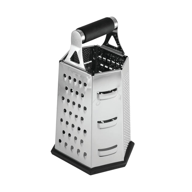 A stainless steel box grater with a black handle and rubber base. It features four sides for slicing, shredding, and grating foods like cheese or vegetables. The box grater is dishwasher safe and stands upright on a white background.