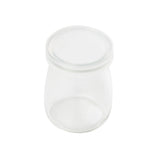 A small, clear single-serve jar with a matching glass lid, viewed from above on a white background. The jar is empty and has smooth, rounded sides with no visible markings or labels.