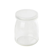 A small, clear, empty glass jar with a wide mouth and a flat, round, transparent lid. The single-serve jar has smooth sides, sits on a white background, and is dishwasher safe. The lid fits snugly on top of the jar.