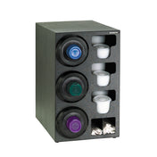 A black cup dispensing cabinet holds three stacks of coffee cup lids, four rows of white disposable creamer cups, and two compartments at the bottom for wooden coffee stirrers. The rectangular unit features a textured finish and a practical straw organizer.