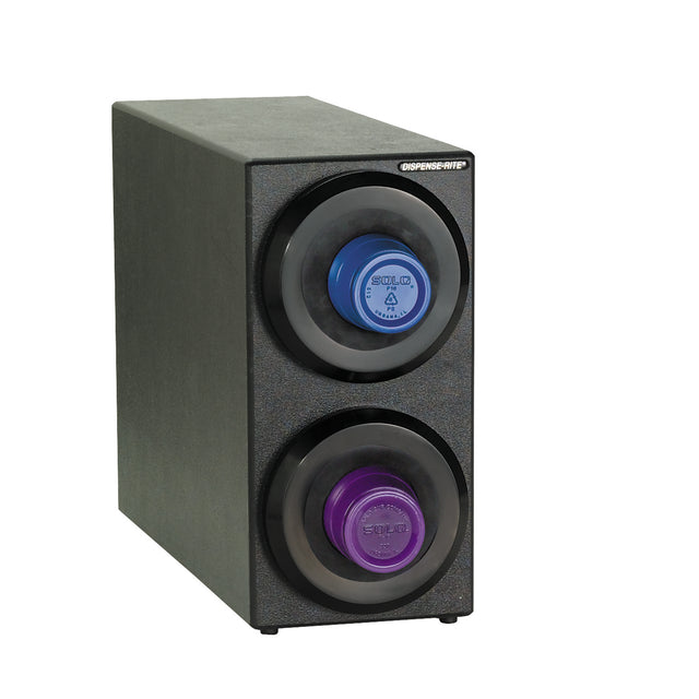 A black rectangular dispenser, NSF certified, holds two round SOLID soap cartridges—blue on top and purple below—in circular slots. “DISPENSAMATIC” appears in the upper right corner, similar in function to cup dispensers or a cup dispensing cabinet.