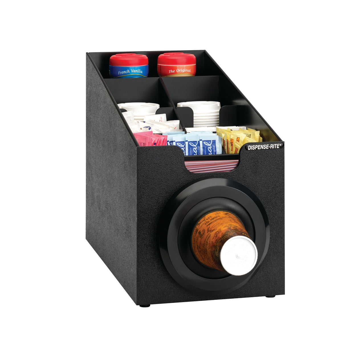 A black countertop organizer with a built-in cup dispenser holds coffee supplies: two red-lidded flavor containers, white plastic cups, assorted sugar and creamer packets, and a wooden DISPENS-RITE cup dispensing cabinet at the front.