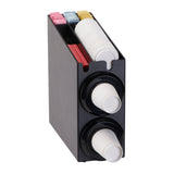 A black Cup Dispensing Cabinet holds stacked disposable cups in two NSF cup dispensers with interchangeable silicone baffles. White cups are visible at the ends, while the top compartment contains stir sticks and assorted packets.
