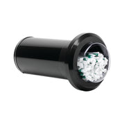 A black cylindrical straw dispenser with a wide, round opening is shown lying on its side. Inside the transparent front opening, crumpled white and green paper scraps are visible, indicating the dispenser is partially filled with trash.