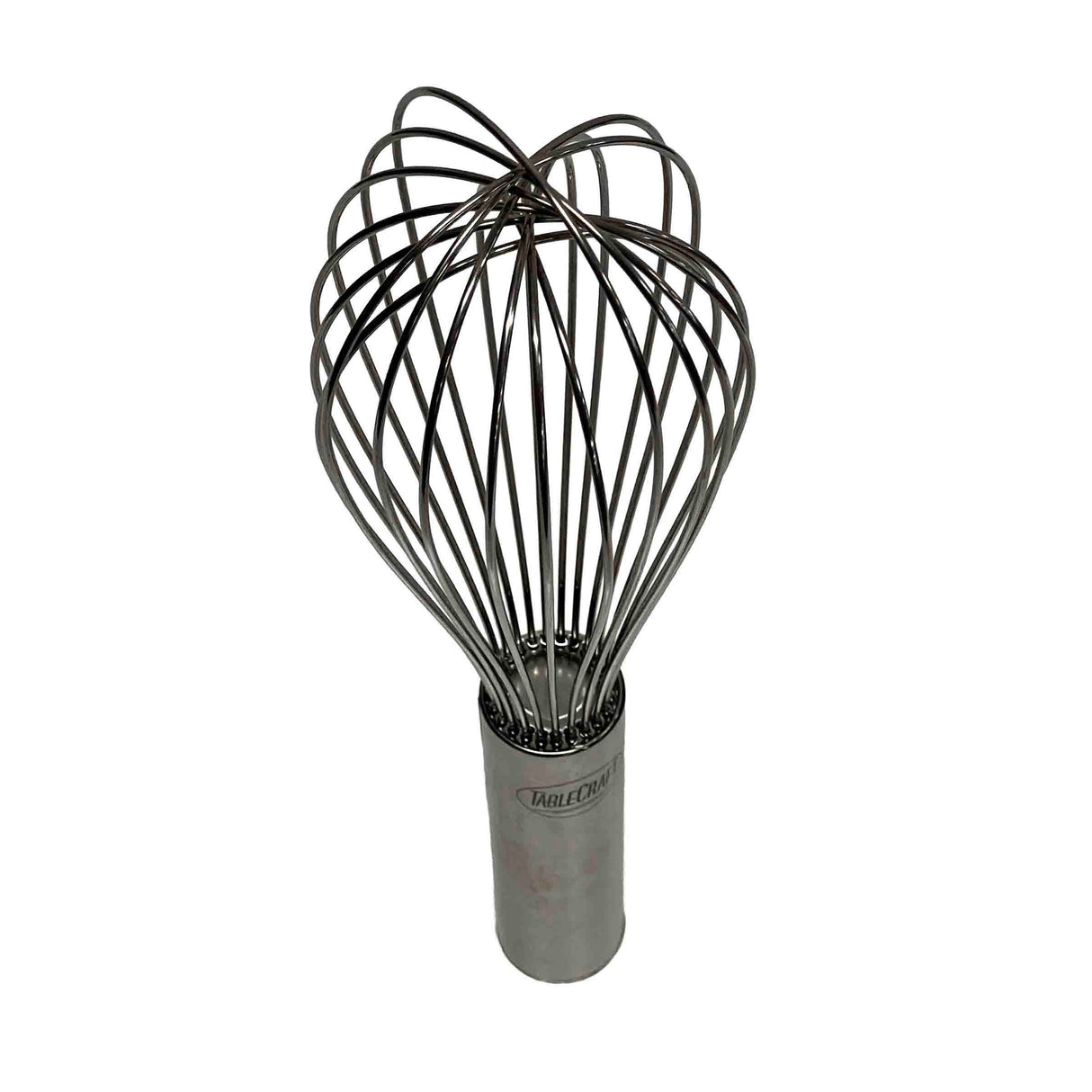 A stainless steel Piano Whip with multiple looping wires forms a balloon shape, attached to a cylindrical handle. This TableCraft utensil is used for mixing or whipping ingredients in cooking or baking. The background is plain white.
