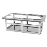 A stainless steel test tube rack with rectangular side openings and circular holes on top for holding test tubes or 16 oz bottles, displayed against a plain white background. The metal rack has a sturdy, rectangular structure suitable for laboratory use.