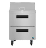 Front view of a Hoshizaki stainless steel sandwich top refrigerator on four wheels. It has a flip-up top with a handle, two drawers with black handles, and a small round manufacturer logo on the bottom right side.