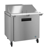 A Hoshizaki Steelheart Series Mega Top Refrigerator with a stainless steel finish, top lid, white cutting board, single door, and handle. It’s on wheels for mobility, features a small blue logo, and is ideal as a commercial reach-in refrigerator for kitchens or restaurants.