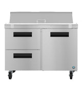 A Hoshizaki Steelheart Series prep table featuring two left drawers, two right doors, black handles, casters for mobility, and a raised back section with covered compartment—ideal as a kitchen or restaurant sandwich top refrigerator.