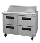 A stainless steel sandwich top refrigerator with four black-handled drawers, a raised prep surface, hinged top lid, and wheels for mobility. Its industrial design is perfect for any professional kitchen or food service environment.
