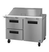 A Hoshizaki SR48B-18MD2 Mega Top Refrigerator prep table features two left drawers, a right two-door cabinet, a white cutting board, and a raised covered compartment—all on wheels for easy mobility. Ideal for any commercial kitchen.