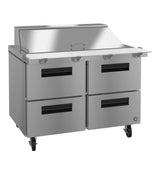 A commercial stainless steel prep table with a top work surface, raised covered section at the back, and four large black-handled drawers below. This sleek unit is on wheels and pairs perfectly with a Mega Top Refrigerator for efficient kitchen setups.