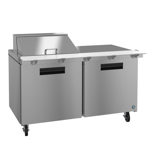 A commercial stainless steel prep table with two doors, a raised back section with a lid, and four caster wheels. Inspired by Hoshizaki Steelheart designs, this sleek unit offers a spacious, flat surface for food prep with an industrial look.
