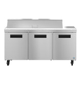 A three-section stainless steel sandwich top refrigerator prep table with three front doors, black handle slots, four caster wheels, a flat work surface, and a raised rear section with a hinged lid sits against a plain white background.
