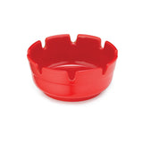 A bright red, round red melamine ashtray with smooth sides and six evenly spaced grooves for resting cigarettes. The glossy finish adds style, and this Economy Ashtray is dishwasher safe. Shown on a white background.