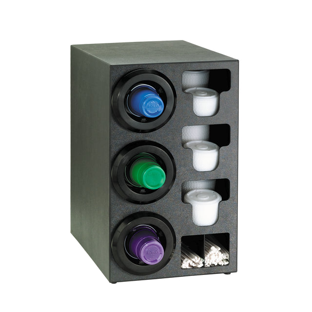 Black organizer with three circular compartments for single-serve coffee pods (blue, green, purple). Beside each pod are cylindrical white creamer containers. At the bottom, two small sections act as straw organizers for white stir sticks.