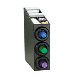 A black coffee organizer with an NSF-certified cup dispenser cabinet holds three rows of coffee pods—purple, green, and blue. On top, compartments keep stir sticks, napkins, sugar packets, and creamers neatly arranged for easy access.