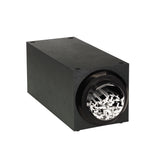 A rectangular black stackable straw dispenser with a circular opening at one end reveals white paper strips inside, reminiscent of a paper shredder’s output. The matte-finished box features four visible screws on its top corners.
