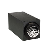 A rectangular black stackable straw dispenser with a circular opening at one end reveals white paper strips inside, reminiscent of a paper shredder’s output. The matte-finished box features four visible screws on its top corners.