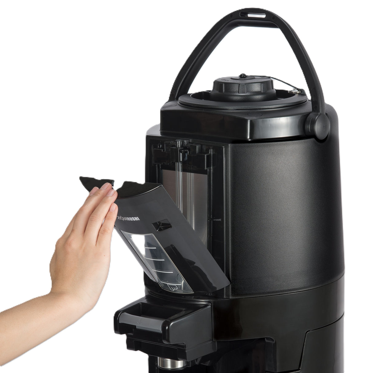 A person’s hand removes a transparent water reservoir from a sleek, black beverage dispenser coffee maker with a curved handle on top. The modern machine features measurement lines on the tank and an insulated, cylindrical design.