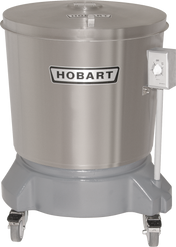 A large, stainless steel Hobart commercial food processor with a 20 gallon capacity features a cylindrical body labeled HOBART, timer dial on the right, flat lid on top, and a sturdy base with four caster wheels for mobility.