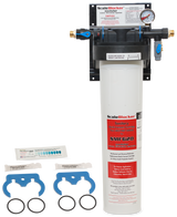 A Vulcan SMF620 SCALEBLOCKER Water Treatment System is mounted on the wall. Below, replacement parts include two blue wrenches, two black O-rings, and two small packets. The white filter housing features a pressure gauge and product labeling.