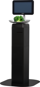 A digital self-service kiosk, like the Hobart FS-100, with a touchscreen display shows a tray holding two pieces of fresh broccoli. This black, rectangular unit stands upright on a wide base, perfect for weighing and scanning grocery items.